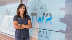 Sandra Vazquez of SWT Fitness standing in front of her gym