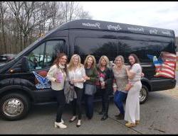 Group of woman in front of AVT Van